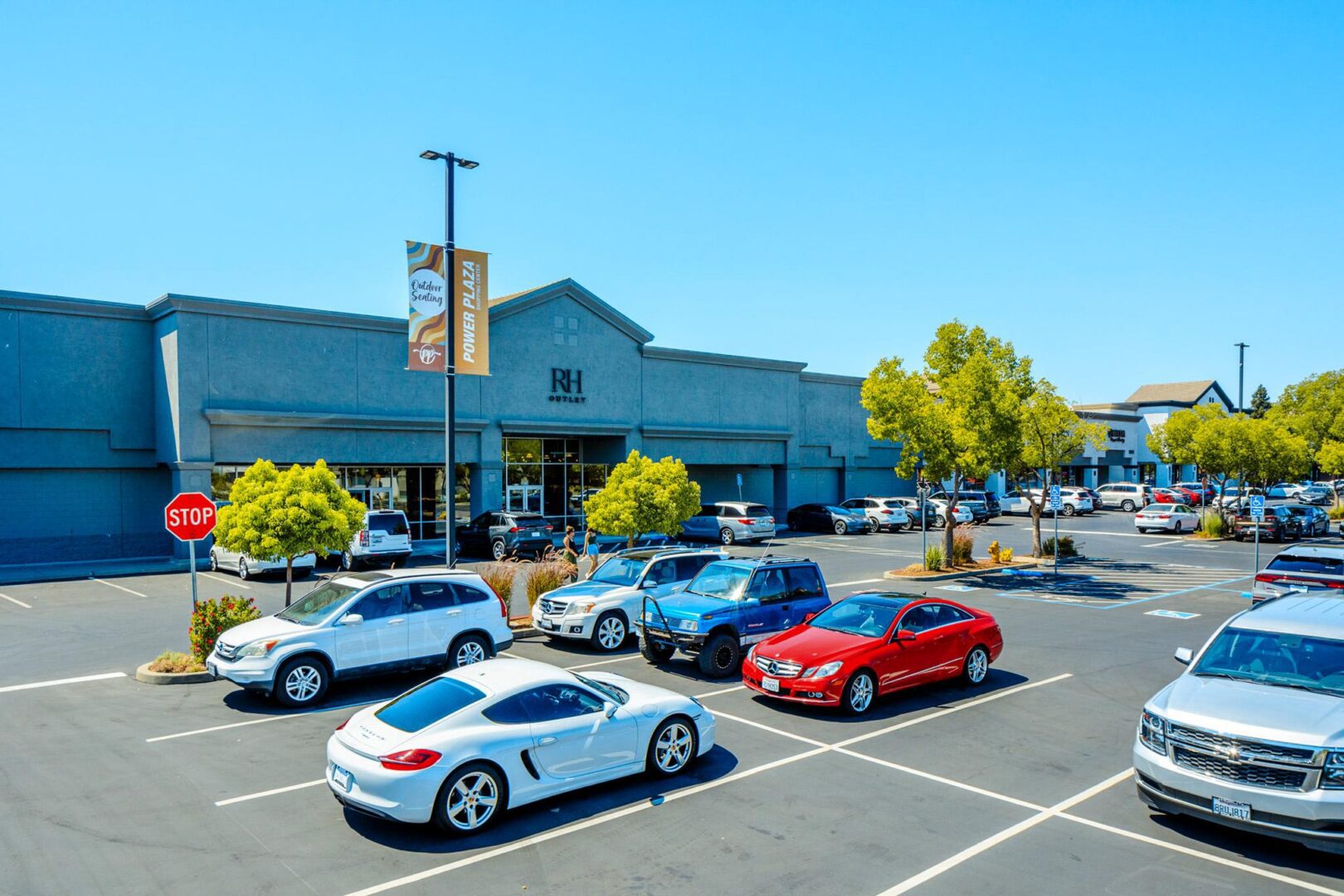 A parking lot with several cars parked in it.