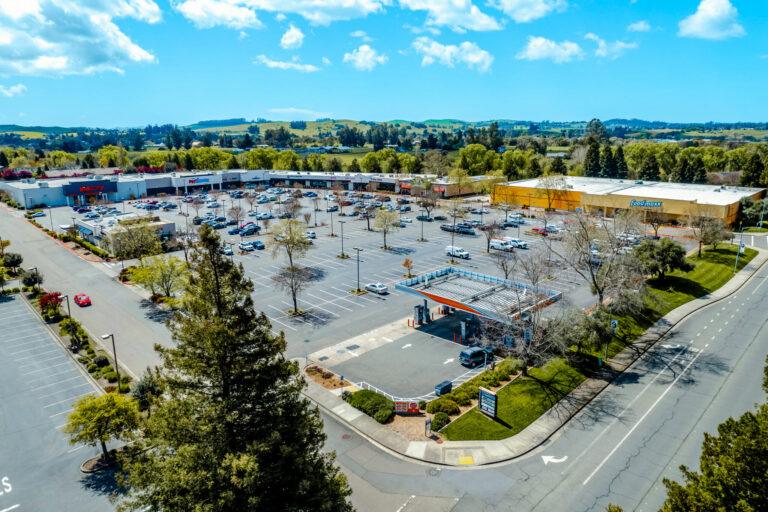 A parking lot with many cars parked in it