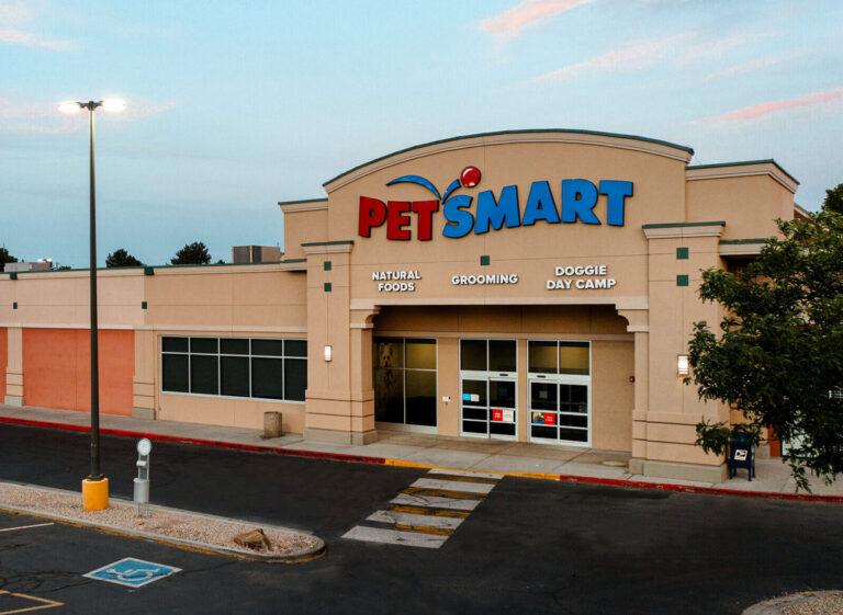 A petsmart store is shown in the evening.