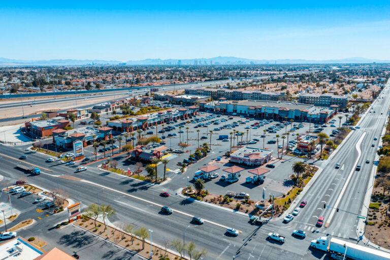 A large parking lot with many cars parked on it.