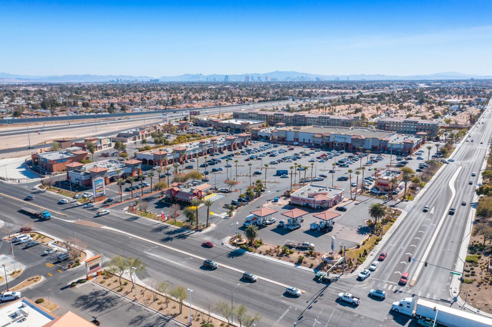 A large parking lot with many cars parked on it.