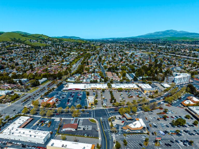 A bird 's eye view of an urban area with lots of parking.