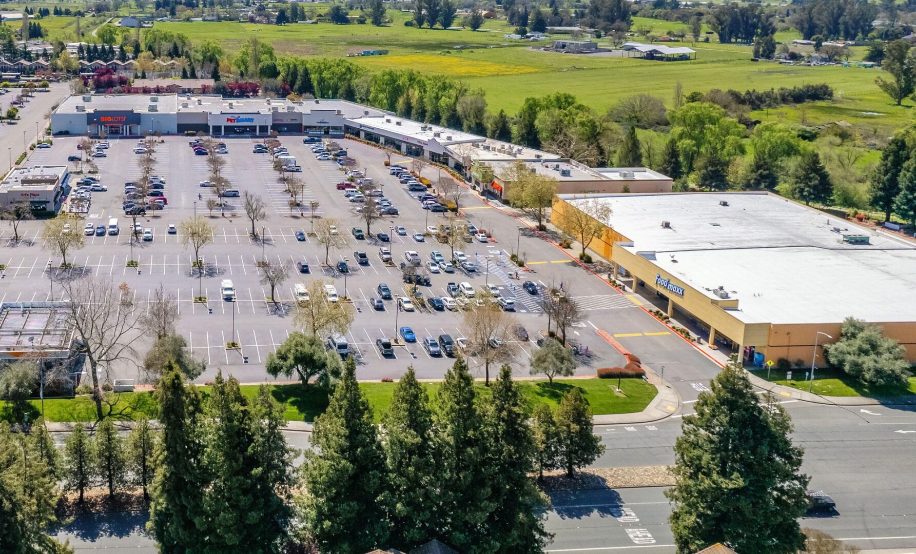 A parking lot with many cars parked in it